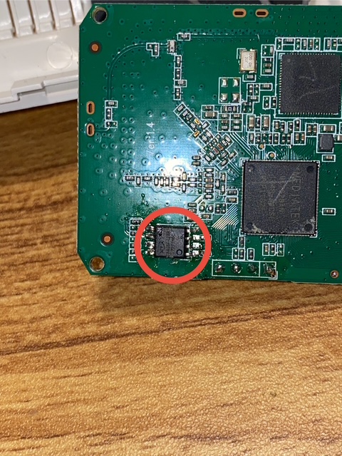 An SOIC-8 SPI Flash chip installed on a PCB, with poor soldering work