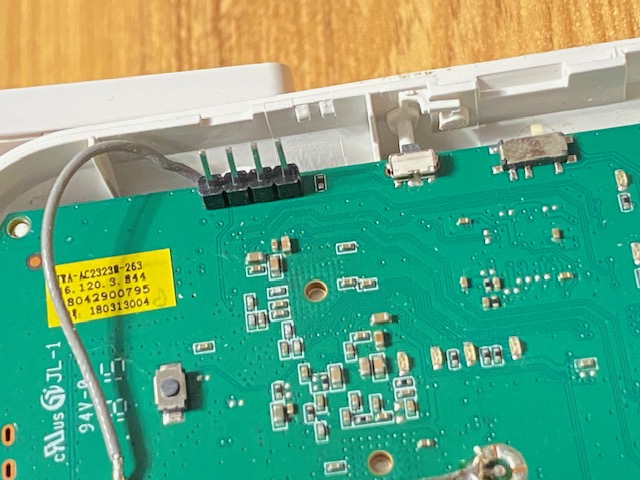A photo of male pin headers soldered to a PCB